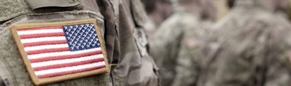 9/11 army soldier in uniform with an american flag patch